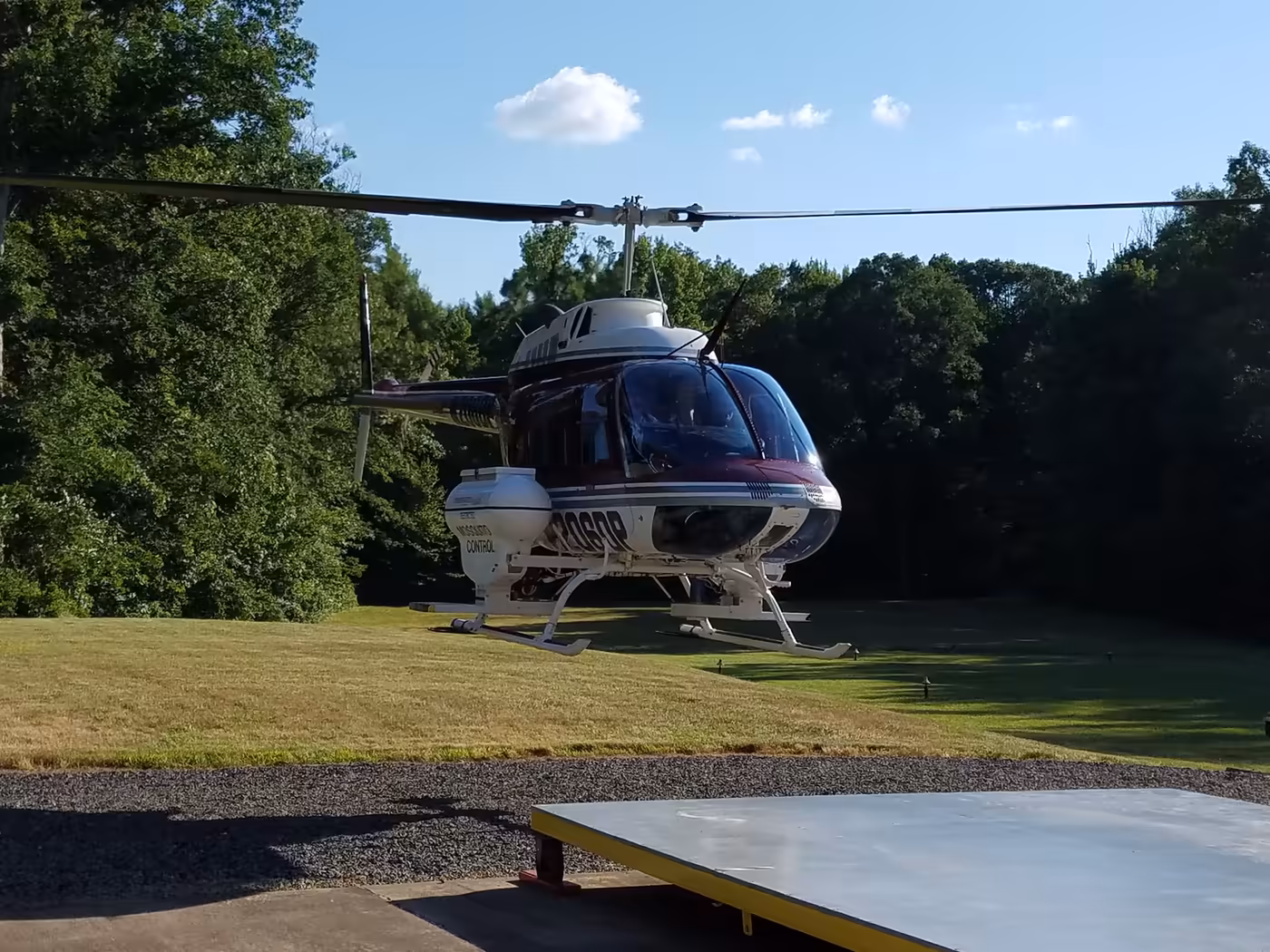 A helicopter on the Commission's landing pad, used for aerial larviciding.
